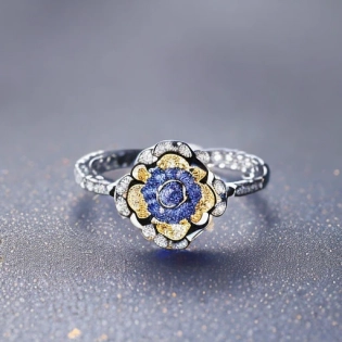 Jewelry design, a ring with bright rose-cut blue diamonds, surrounded by lily-of-the-valley flower-shaped, golden stems form the ring of the ring.
