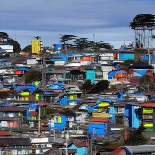 a futuristic cyberpunk city, ancud, chiloe, hypermaximalist + epic + cool + amazing + octane render + ambient oclusion + 8k