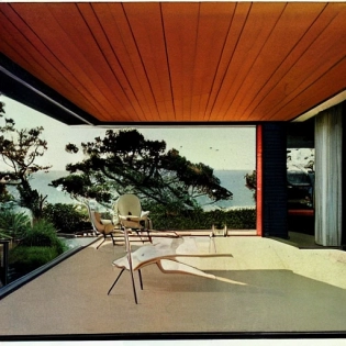 hyper realistic eye level exterior photo of a mid century modern style house overlooking the ocean, daylight, indirect lighting, AD magazine, Frank Lloyd, Eames, Mies van der Rohe