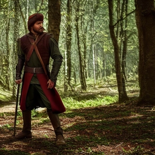 Robin Hood the legend of Sherwood standing in sherwood forest, photorealistic, f 1. 4, 4k