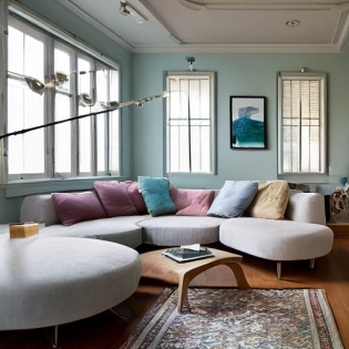 high resolution photography interior design, dreamy sunken living room conversation pit, wooden floor, small windows opening onto the garden, bauhaus furniture and decoration, high ceiling, beige blue salmon pastel palette, interior design magazine, cozy atmosphere
