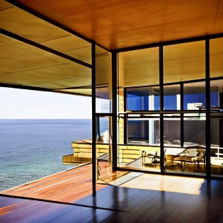 Hyper realistic eye level exterior photo of a mid century modern style house overlooking the ocean, daylight, indirect lighting, AD magazine, Frank Lloyd, Eames, Mies van der Rohe