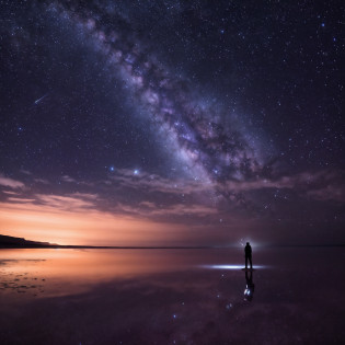 Image of Alphad standing alone on a beach under the stars, lost in the immensity of space, night sky photography, lost in the milky void, looking out into the cosmos, mikko lagerstedt, tranquility of the endless stars, cosmos sem fim no fundo, astronault, space photography, the sky has the milky way, astrophotography