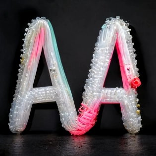 Typography letter A, hardware parts and cables full of laces, foam bubble translucent, colour bloom drone tech, hardware parts, werable tech, mixed materials organic and pvc multilayer, hyper realistic, cyber punk -