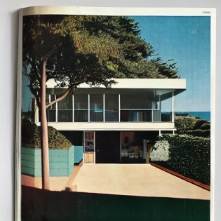 hyper realistic eye level exterior photo of a mid century modern style house overlooking the ocean, daylight, indirect lighting, AD magazine, Frank Lloyd, Eames, Mies van der Rohe