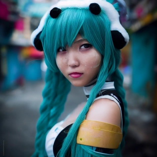 award winning professional outdoor cosplay photography, the cutest girl is wearing an authentic cosplay of Hatsune Miku, in the slums of Manila, her face looks really pretty, breathtaking details --testp --upbeta