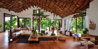 inside caribbean home, living room, wooden floor, small windows opening onto the garden, high ceiling interior design, cozy atmosphere