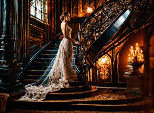 arafed woman in a wedding dress standing on a staircase, extravagant dress, intricate gown, ornate and flowing, fantasy long intricate gown, sitting on a grand staircase, ornate gown, romantic gown, stunning elegant pose, luxurious wedding, wearing a magnificent dress, dressed beautiful gown, beautiful gown, ornate and elegant, royal gown, stunning elegant, ornate royal gown