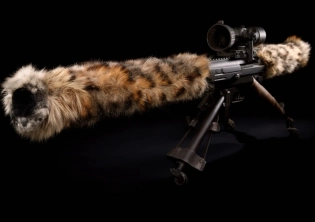 Breathtaking photo of an an antitank rocket launcher with leopard skin, as an art piece. ::5 The weapon is an imposing artistic piece, presenting an BGM 71 TOW missile launcher, covered in soft leopard fur. The exhibition is clearly created to provoque reflection, by presenting antitank launcher covered in animal skin. Shot in professional photography studio, using a neutral grey background. ::4 The general composition creates an intriguing duality between the hard object and the soft fur. ::3 professional studio illumination, softbox light, bokeh. Camera is positioned from a 45 degree angle, close-up, 35mm lens, ISO 100, low shutter speed, aperture f4. Professional product photography, high quality stock image, digital photography ::3 --no text, signature, watermark, username, low resolution, low quality, jpeg artefacts, blurry, cropped, unframed --ar 7:5 --v 5 --c 10 --seed 3