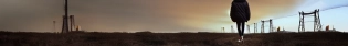 Ruined city, nuclear power plant, (creepy atmosphere:1. 32), single_girl, standing with (her back to the viewer:1. 0), head looking at the viewer, (dark atmosphere:1. 32), yellow jacket with a hood, hood behind her head, hunting backpack, radiation fund, 8k, UHD, HDR, (Masterpiece:1. 5), (best quality:1. 5) trending on artstation, volumetric lighting, octane render, Photograph, 8k, UHD, HDR, (Masterpiece:1. 5), (best quality:1. 5),
