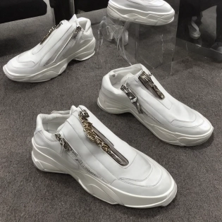 futuristic balenciaga sneakers, highly detailed, hyper realistic, baguette chain zips, a ton of bussdown iced white gold bling in wallace